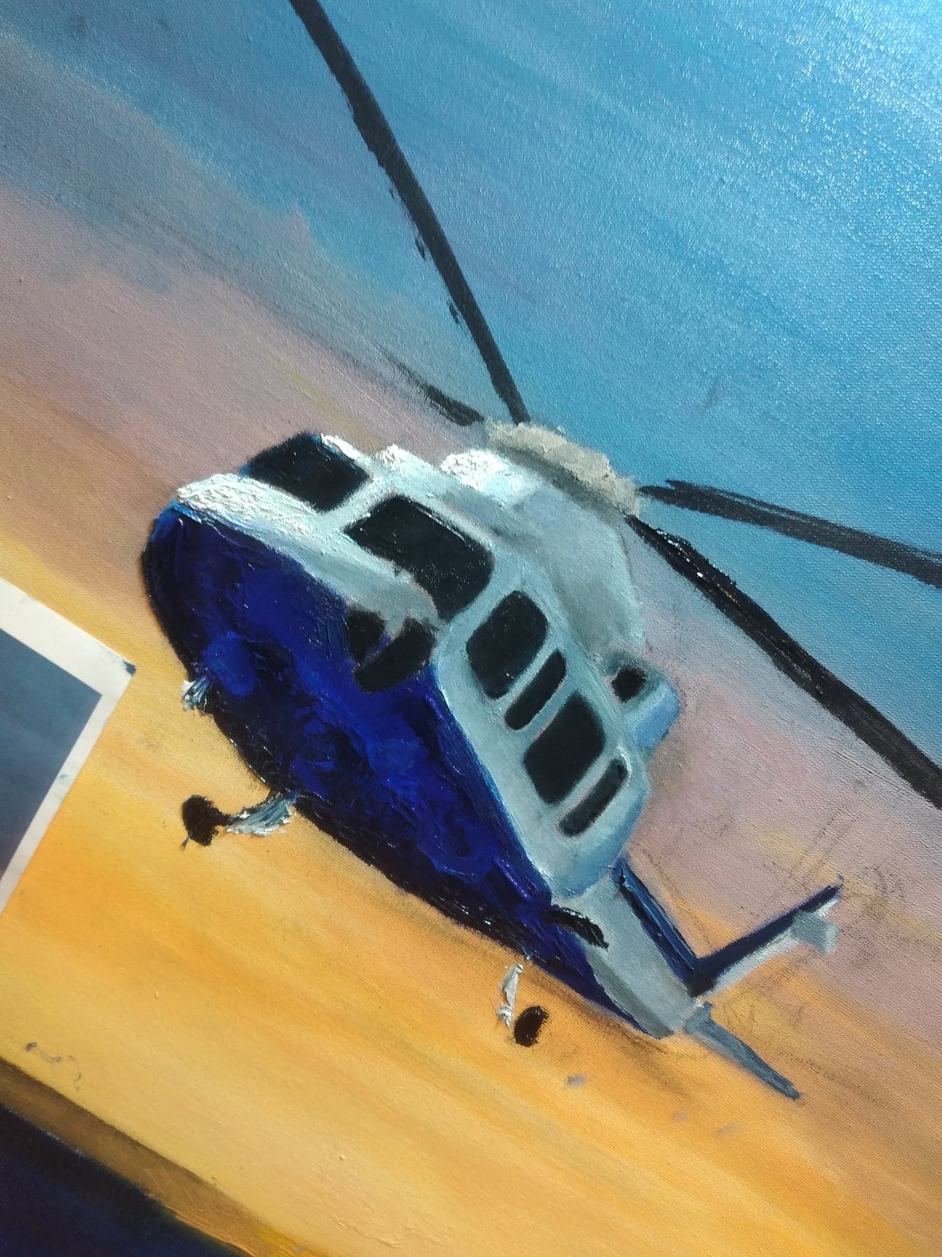 Traditional painting study of a blue and white helicopter against a warm sky.