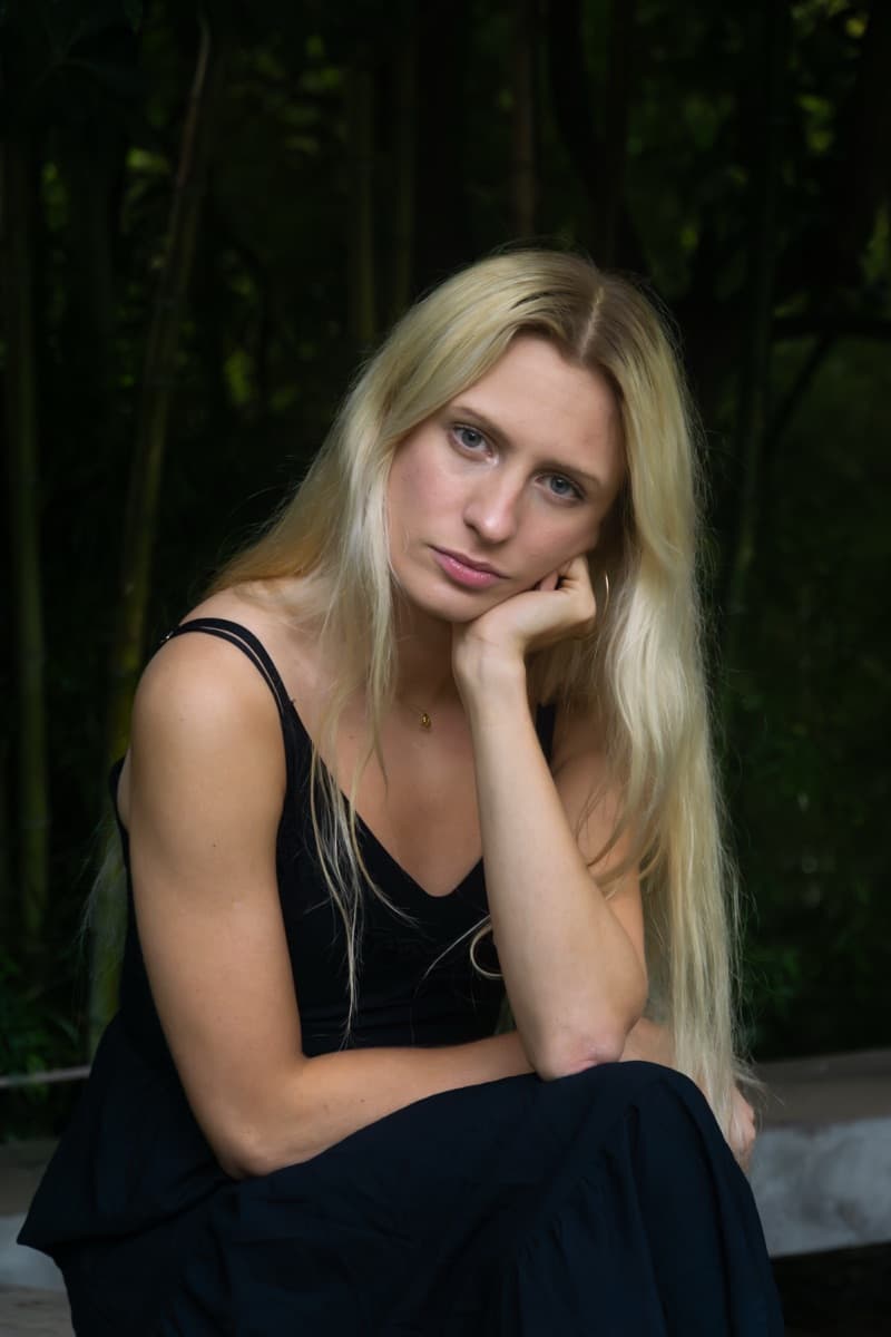 Close-up portrait of Luna in soft natural lighting from the Gulbenkian gardens photoshoot.